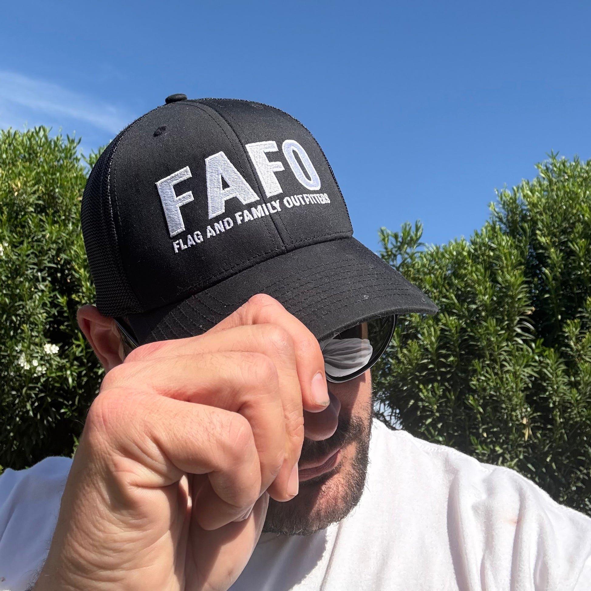 FAFO trucker hat in black — bold embroidered FAFO logo front panel FAFO hat for sale patriotic outfitters man wearing