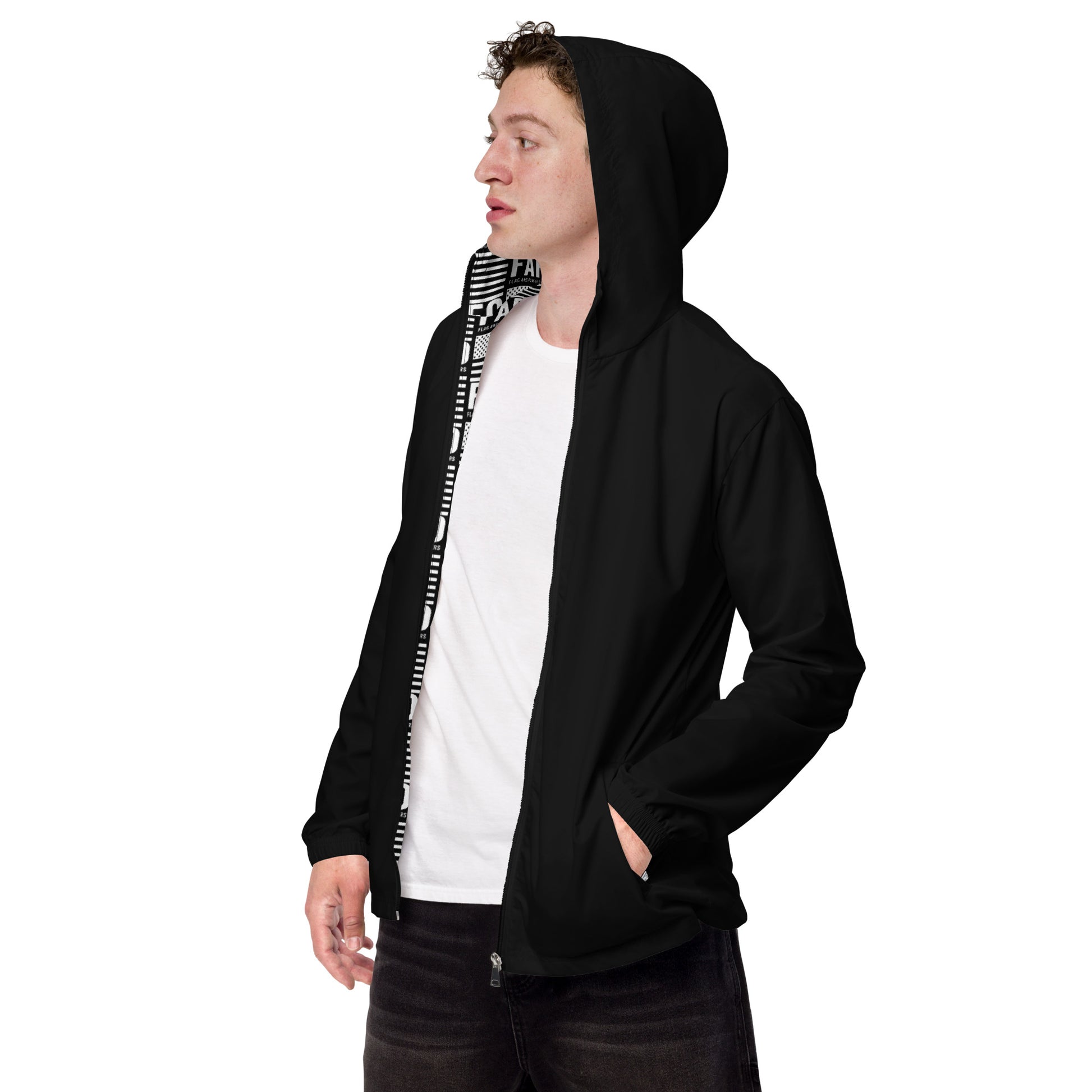 Interior of black FAFO windbreaker — bold FAFO logo all-over print lining FAFO merchandise flag and family outfitters